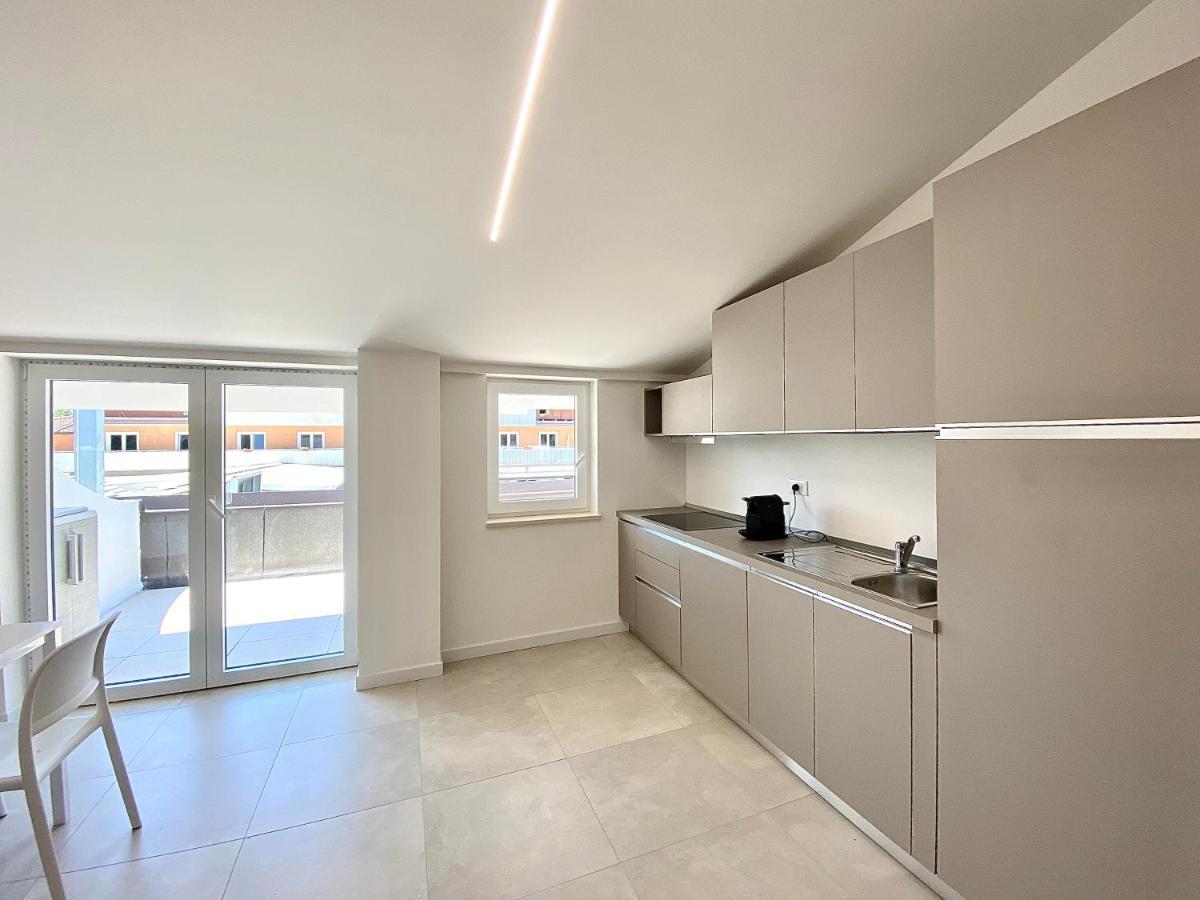 Em Apartments Lignano Sabbiadoro Bagian luar foto